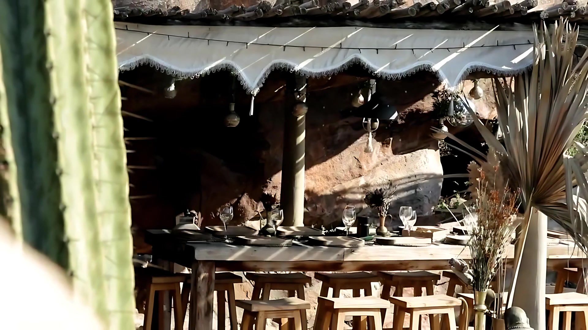 Seafood, salads and bread on a long wooden table in the garden